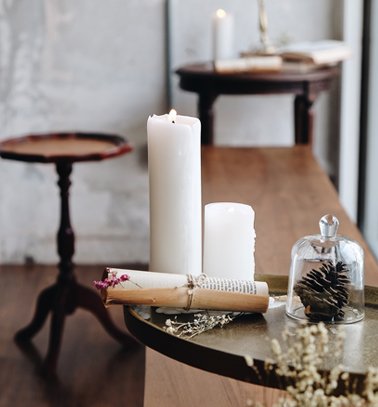 a table with candles and a candle holder