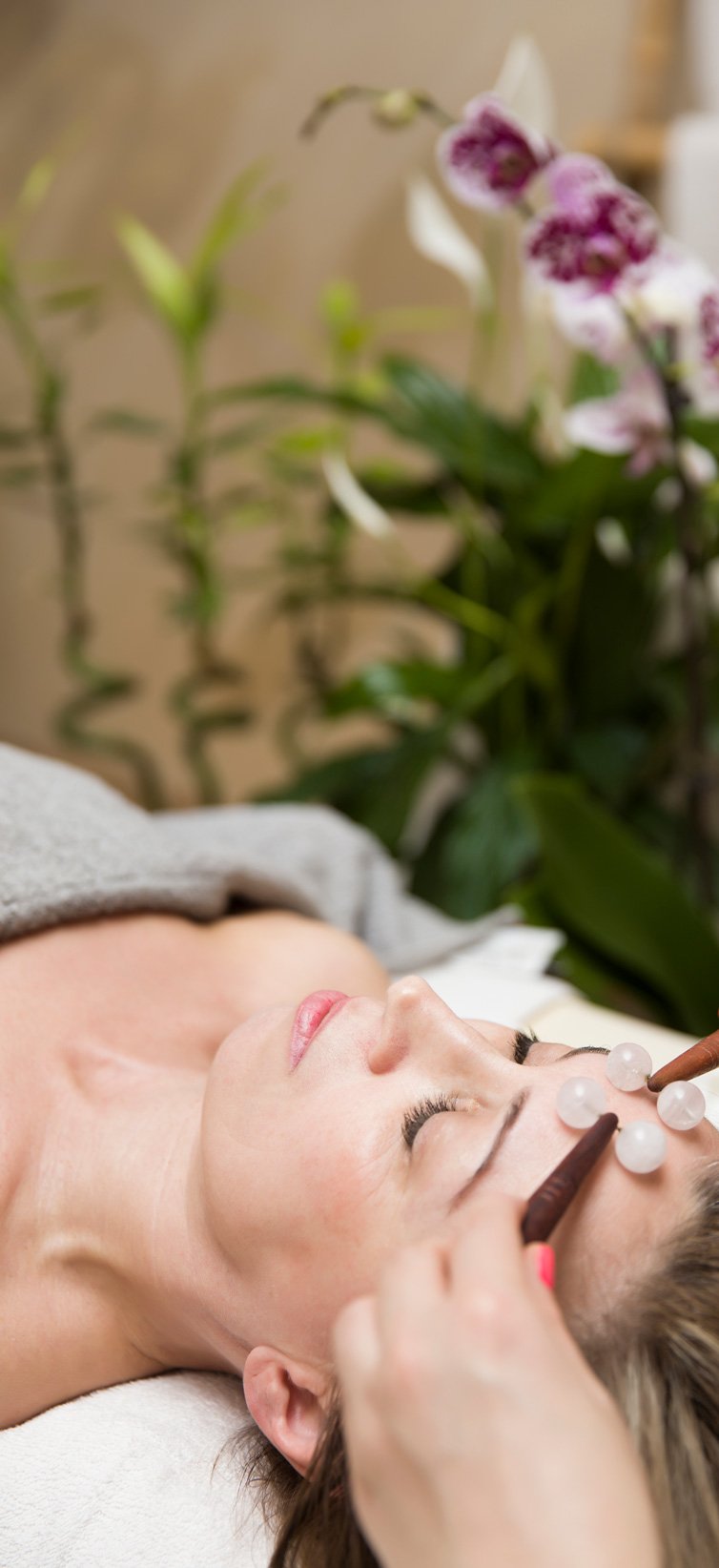 a woman getting a face massage